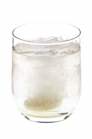 glass of water with fizzy tablet