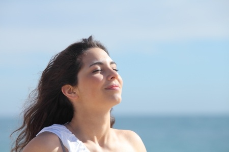 happy woman smiling near the ocean