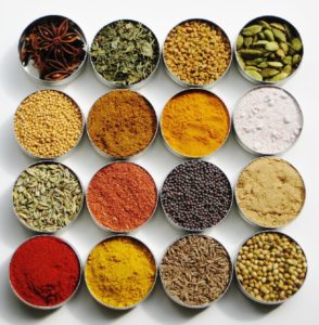 various herbal powders arranged on a table