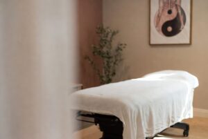Treatment table in a room, preparing for dry needling treatment